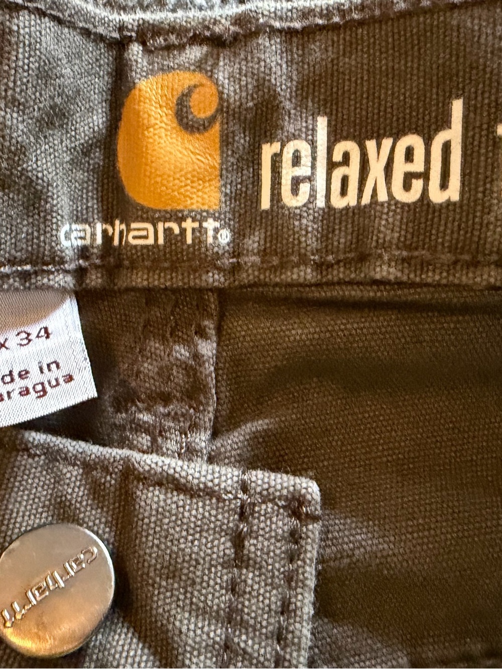 Carhartt Relaxed Fit Men's Jeans in Charcoal Gray with Gold Logo